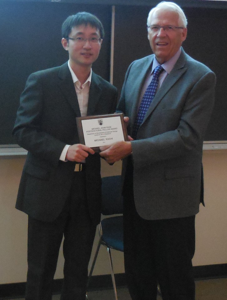 Roger Page presents the award plaque to Dr. Michael Yucci, recipient of the Michael John Page Postdoctoral Fellow Award