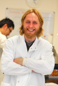 Dr. Neil Mackenzie in a lab coat