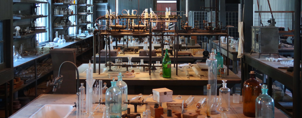 Photo of a laboratory that contains equipment used by Thomas Edison. It is part of the Edison and Ford Winter estate. He used the laboratory to find the best rubber plant. Used to illustrate the idea of special considerations for laboratory design. Photo by Sieuwert Otterloo / Unsplash.