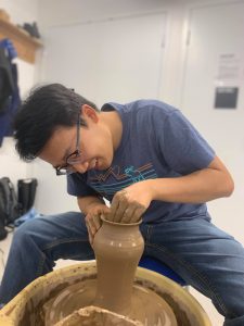 Photo of Andy making pottery